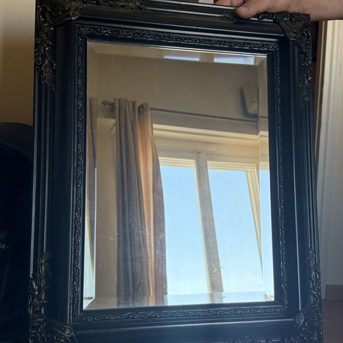 Woodcarved mirror with brass details used