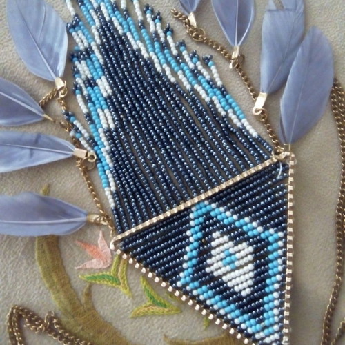 Ethnic necklace used with beads and feathers