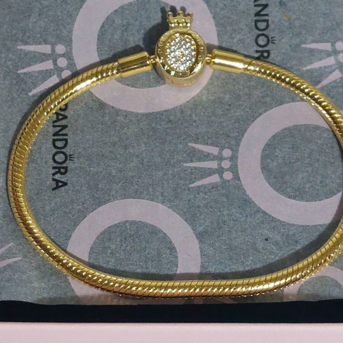 Pandora bracelet size 20 cm, gold plated with crown clasp