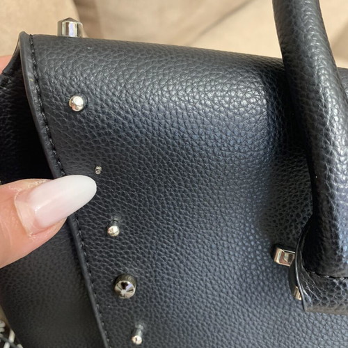 Black handbag with studs used, includes detachable pouch