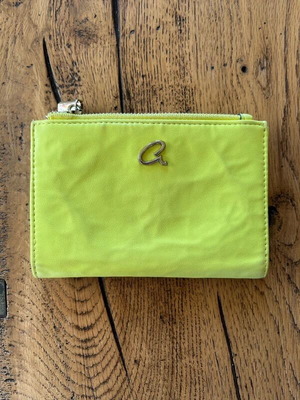Axel wallet used in bright lime color