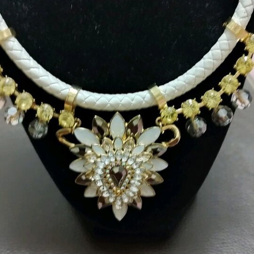 Necklace new with white braid and gold flower details