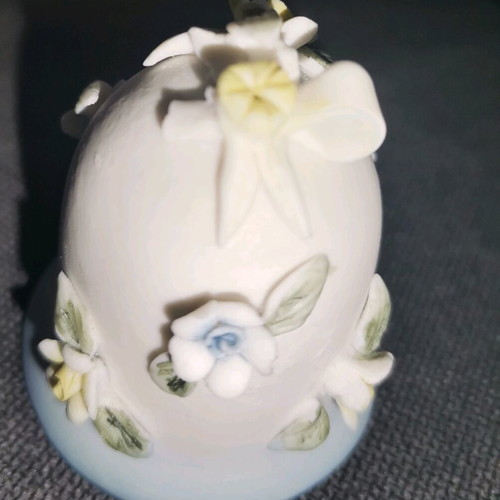 Ceramic bell used with embossed flower designs