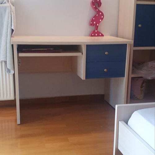 Blue bedroom set with desk, bookshelves and bed