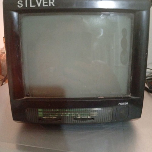 Silver portable radio TV used with AV and car adapter