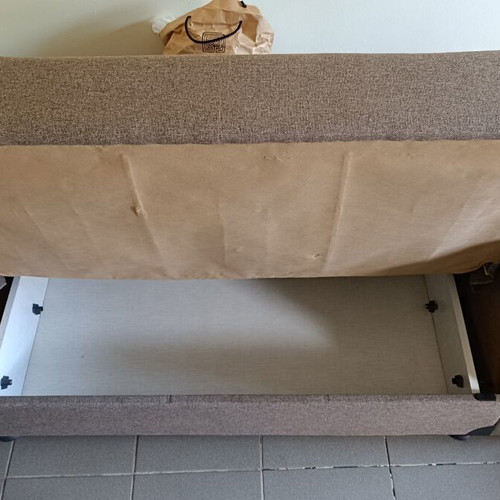 Two-seater sofa bed with storage space