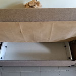 Two-seater sofa bed with storage space