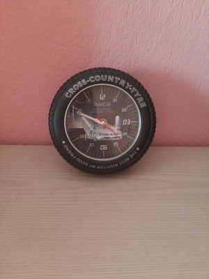 Clock tire-shaped like new, wall and tabletop analog