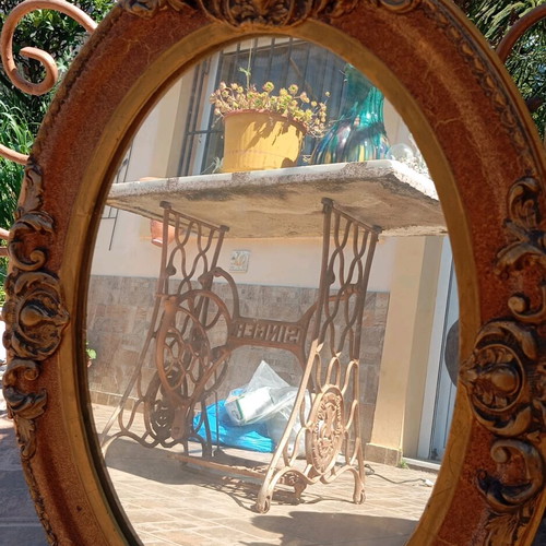 Old carved oval mirror used