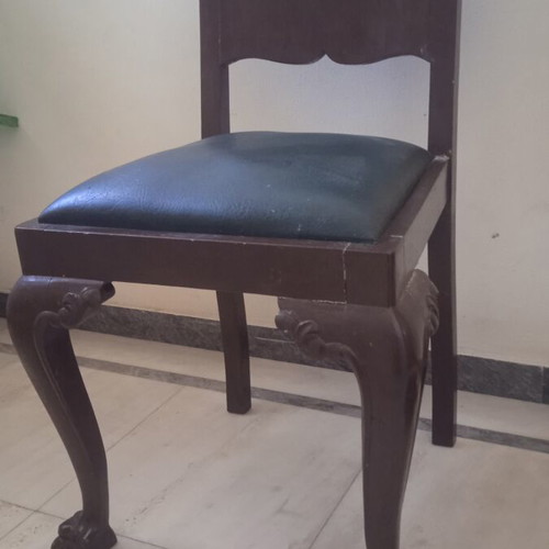 Antique chair used with lion's paw legs needing repair
