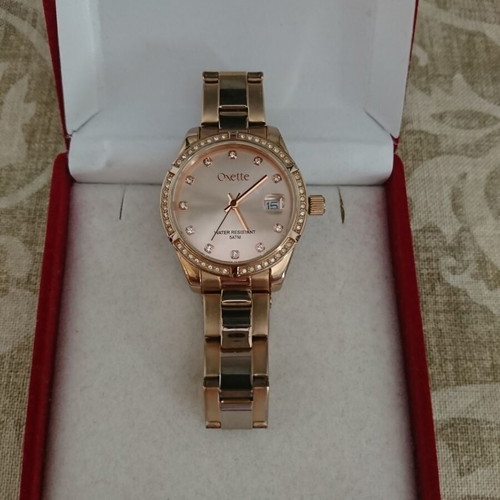Oxette women's waterproof quartz watch with pink gold stainless steel bracelet and rhinestone bezel like new