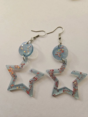 Star-shaped earrings made of resin glass, new, blue with pink rhinestones
