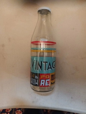 Vintage decorative Italian glass bottle used with metal screw cap