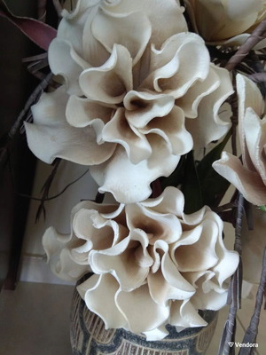Decorative floral arrangement with large earth-tone flowers