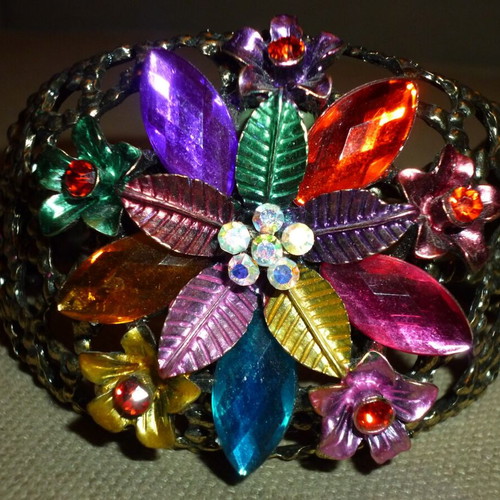 Metal bracelet like new, colorful, heavy, pierced sides
