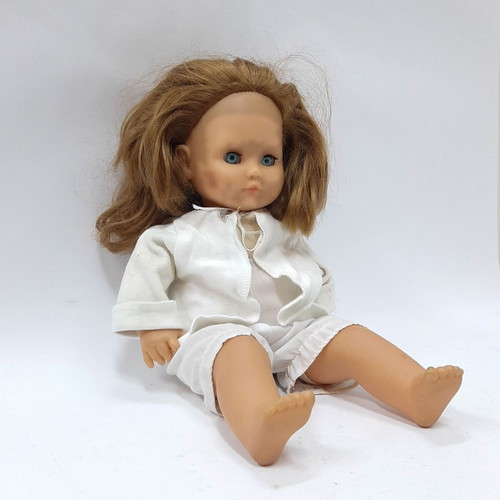 Vintage hard plastic doll with blue sleeping eyes, 1970s