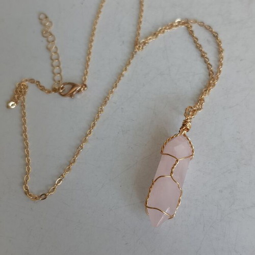 Jewelry set with rose quartz and gold-tone metal elements