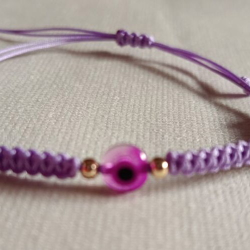 Woven bracelet with eye bead in lilac and fuchsia, new