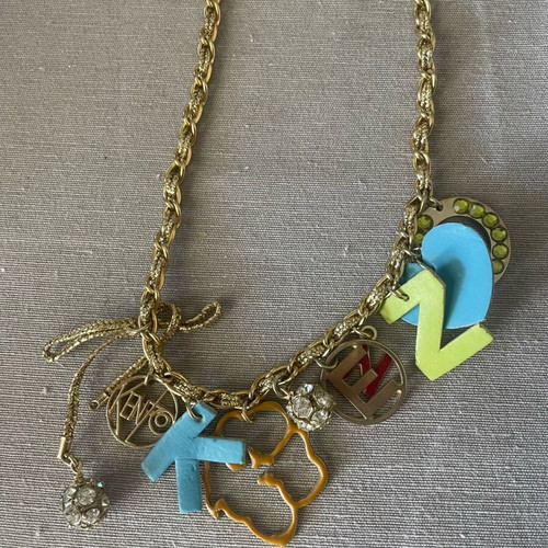 Kenzo necklace and bracelet set like new with unique charms