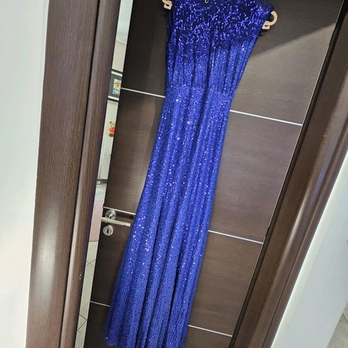 Diamond blue dress like new, open back with shoulder pads