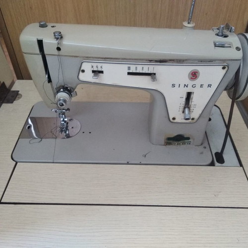Singer sewing machine in cabinet used, functional