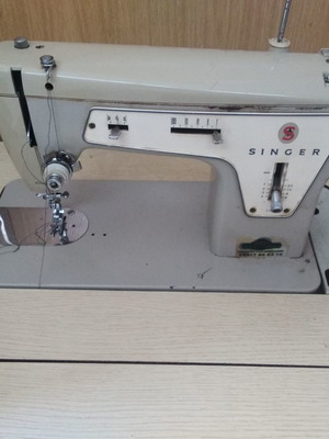 Singer sewing machine in cabinet used, functional