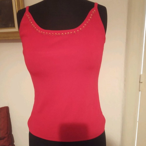 Red top size M like new decorated with pearls and beads
