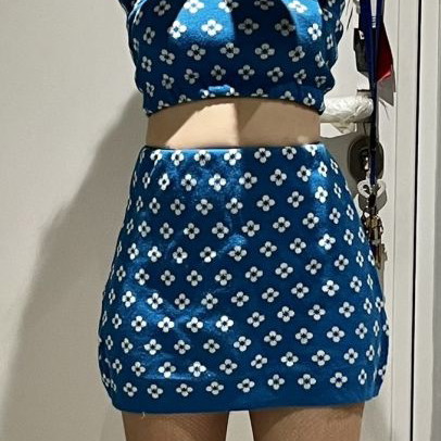Knitted set used size small, top and mini skirt blue with white flowers