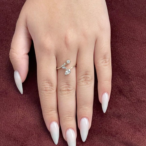 Women's 14K gold ring like new with round cut and pear-shape stones