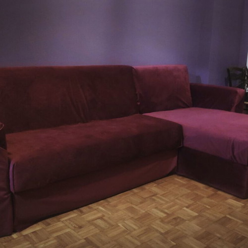 Corner sofa bed used with storage and removable burgundy cover