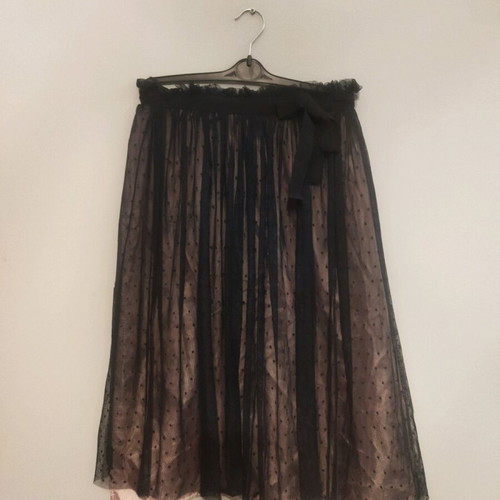 Skirt used with tulle on satin salmon base and black polka dots