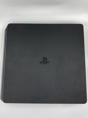 PlayStation 4 Slim like new with box, cable and two controllers