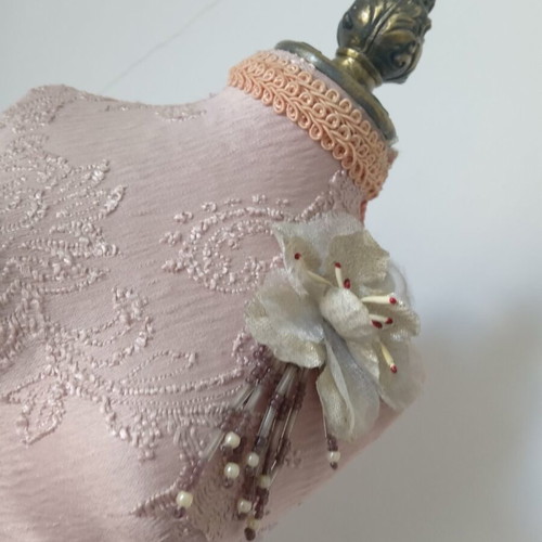 Decorative body like new with embossed designs and fringes