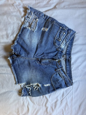 Denim shorts like new with regular waist and rips, size M