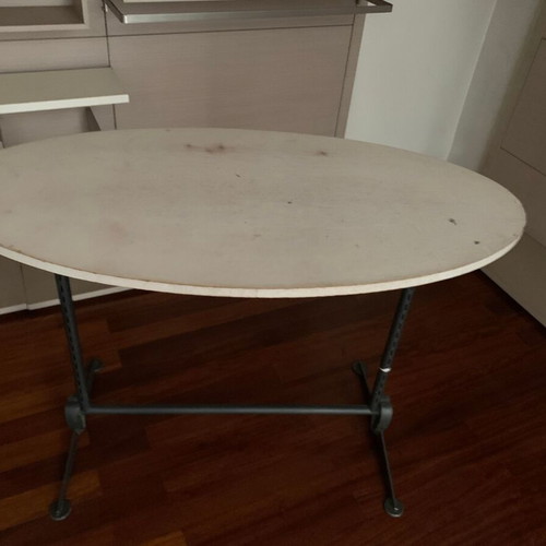 Oval table with metal base used