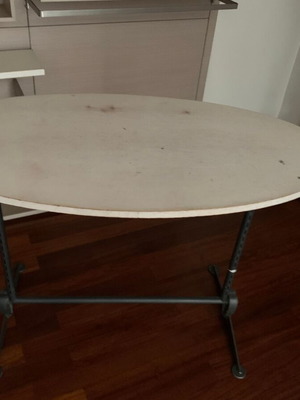 Oval table with metal base used