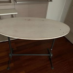 Oval table with metal base used