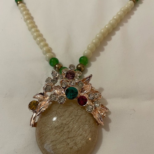 Vintage necklace used with cream and green semiprecious beads and cabochon pendant