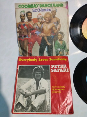 Collectible 45 RPM vinyl records like new, foreign hits 1970s