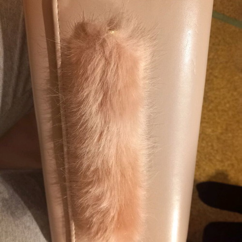 Pink clutch used with chain and slight wear