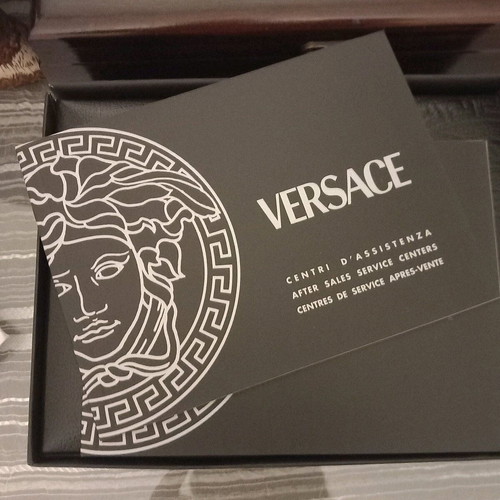 Versace vintage leatherette box like new