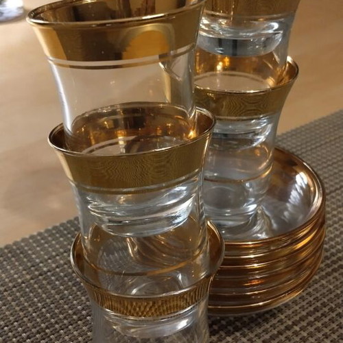 Glasses with Saucers like new with Gold Decoration