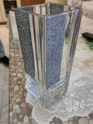 Glass vase used with textured black details