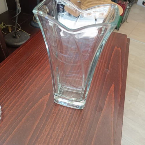 Glass decorative vase with modern wavy design, used