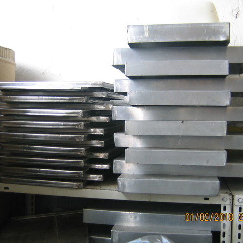 Stainless steel baking trays and serving pans used for cooking