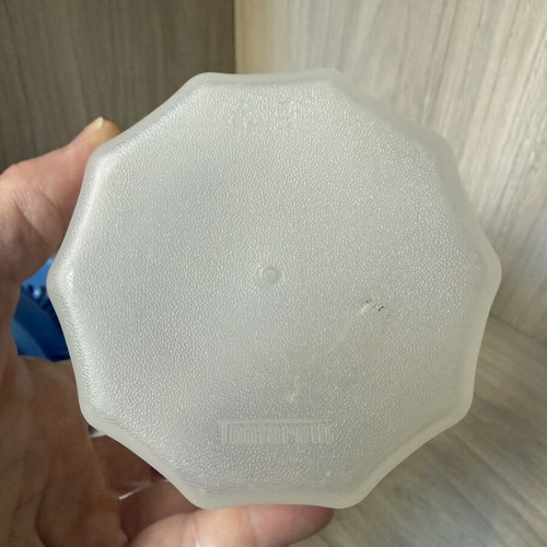 Plastic handheld citrus juicer with measuring container