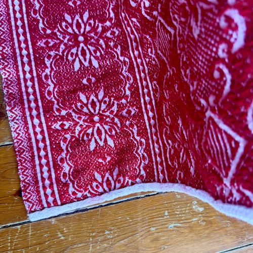 Vintage red wool blanket with geometric and floral patterns
