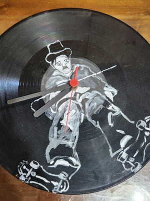 Handmade wall clock from vinyl record with Charlie Chaplin used