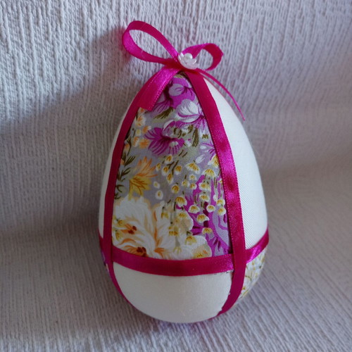 Decorative egg used in floral purple and fuchsia