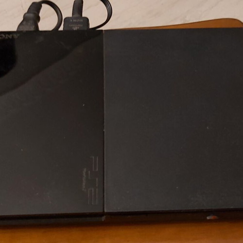 Sony PlayStation 2 console used with remote and 10 games
